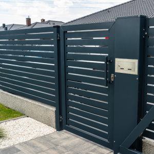 Entrance gate that is black and made of metal